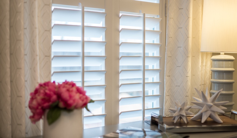 Plantation shutters by flowers in Chicago